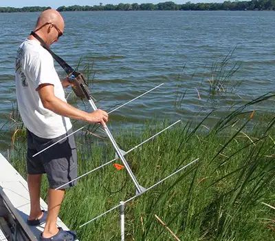 Biologist using radio telemetry