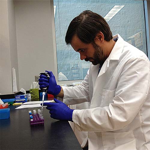 Researcher conducting genetics testing