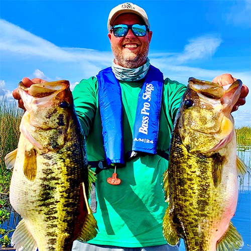 Angler holding bass